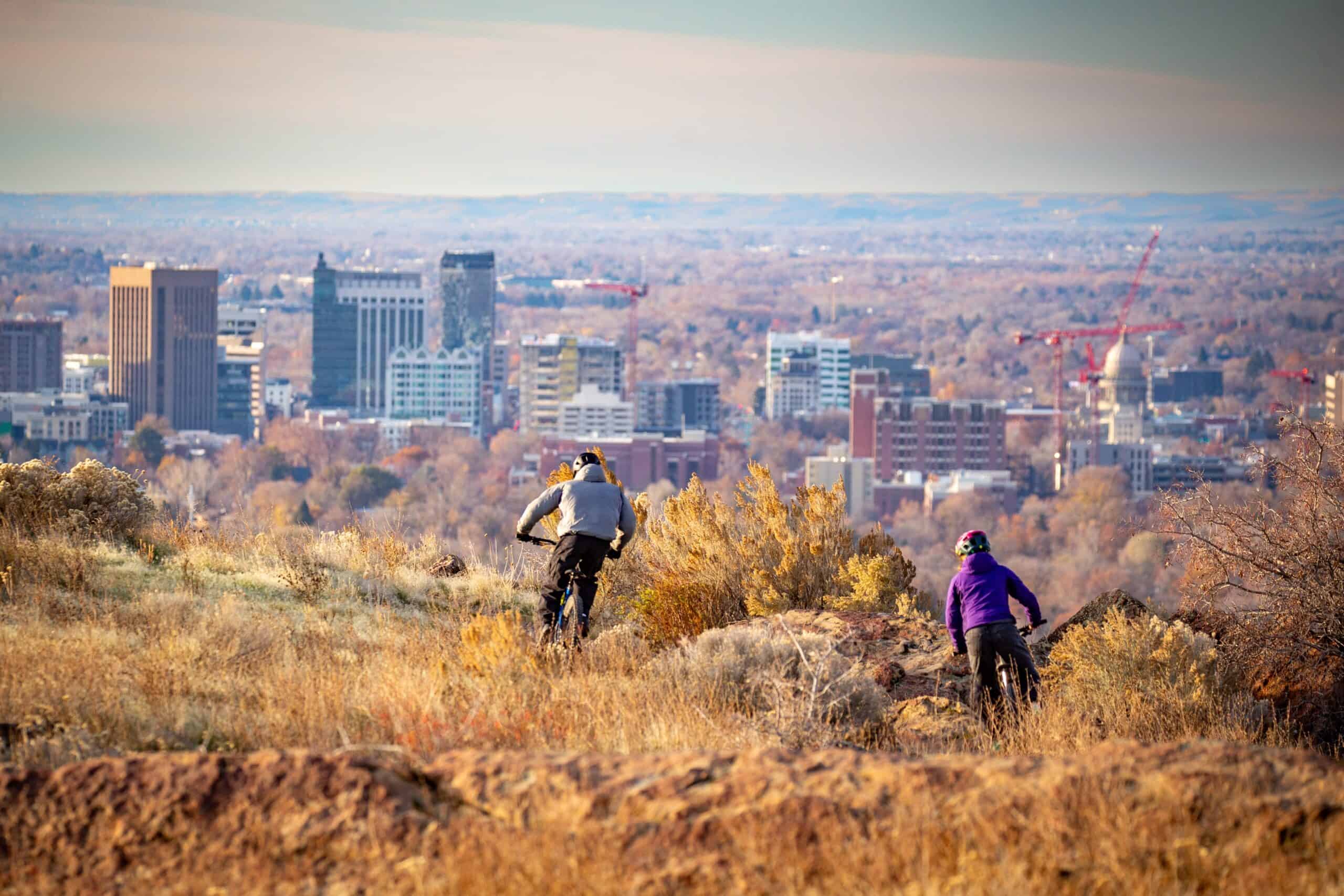 Mountain bikers against Boise Idaho backdrop