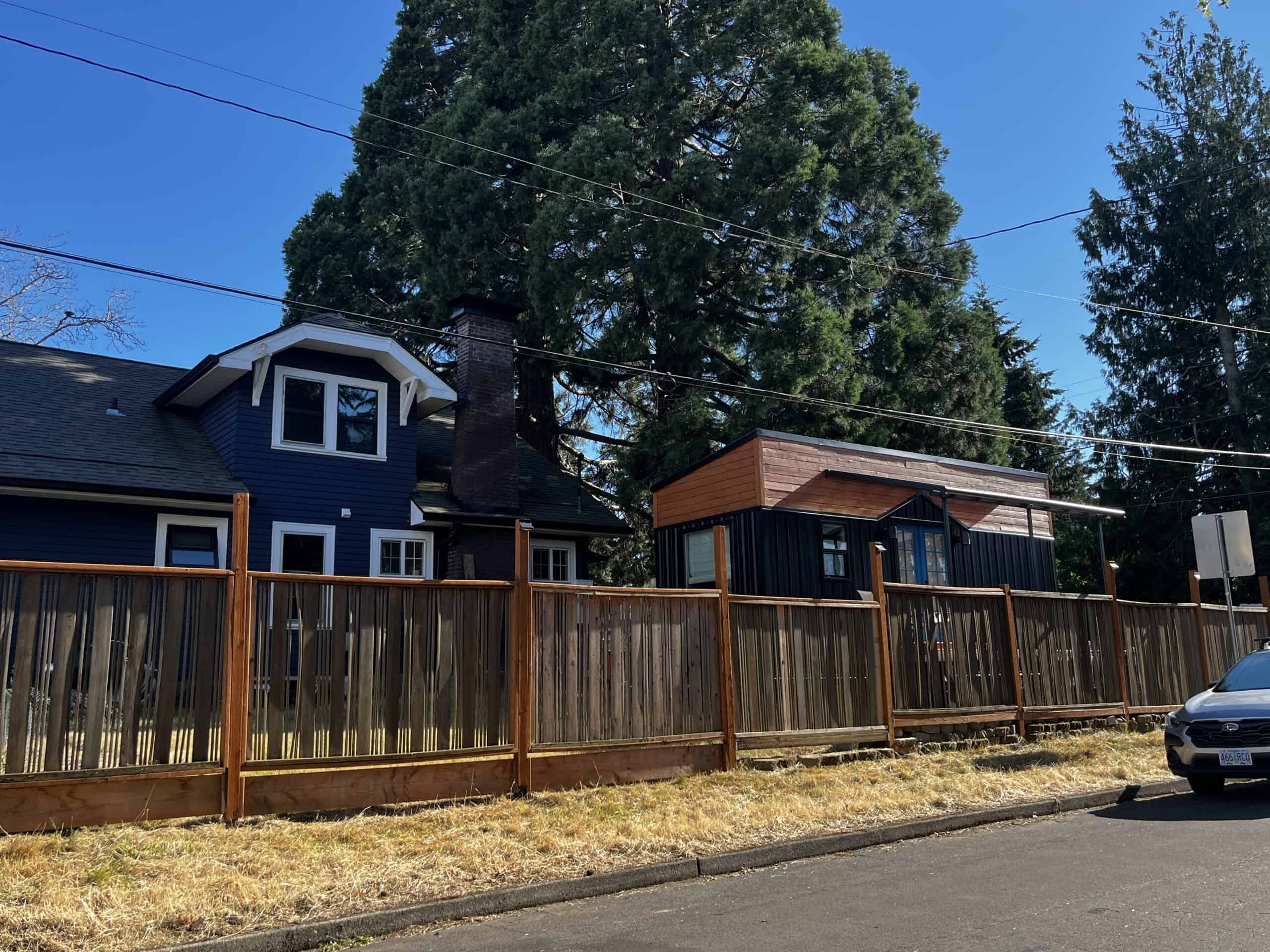 A scofflaw tiny house on wheels, because it is between the house and the street. Photo by Catie Gould. 