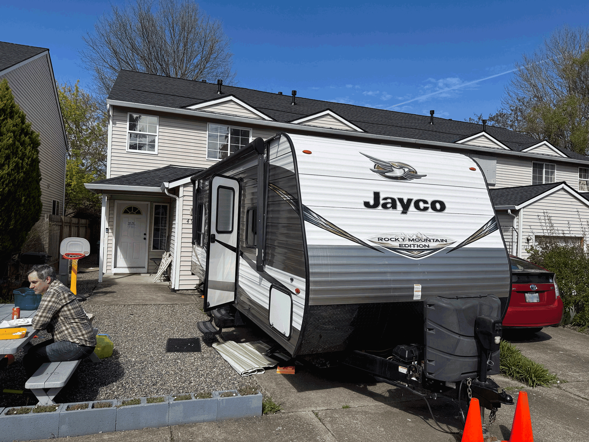 Homeowners are using an RV as temporary accommodation while working on their primary house. Photo by Kol Peterson.