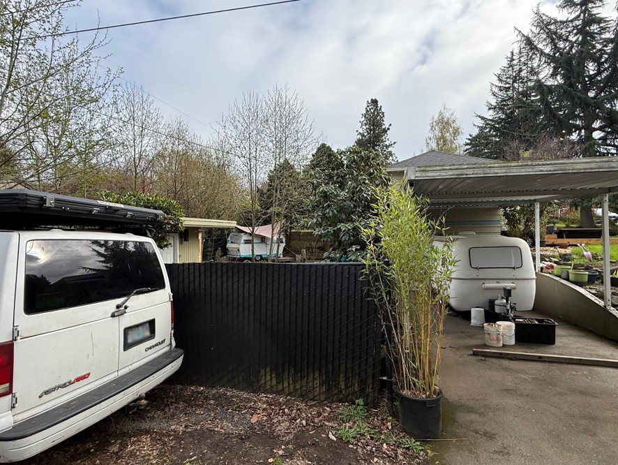 We counted the trailer on the left as being inhabited. It has a rain covering and a small deck, and it’s not easily accessible for road trips. Photo by Kol Peterson.